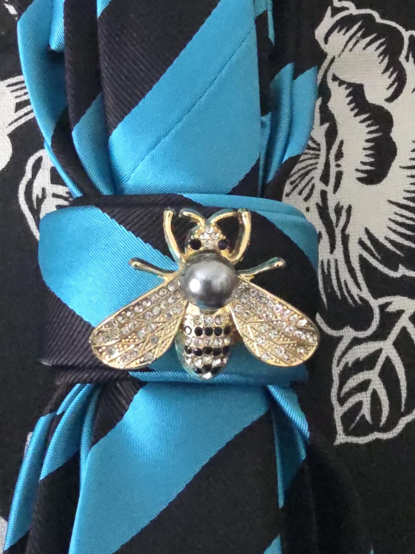 Teal and Black Stripe Silk Necktie Necklace: Rhinestone Bee Brooch